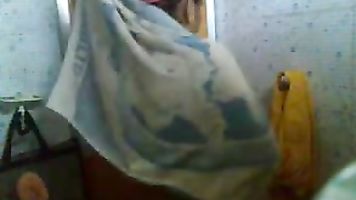 Mallu bhabhi Uttara caught taking shower recorded by her neighbor from toiler window!.