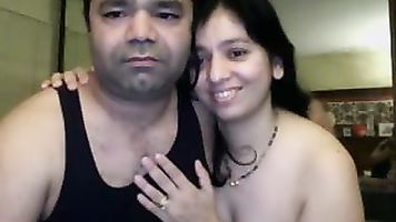 Cute Indian babe sucking her partners cock licking his balls during foreplay while he pumps his dick
