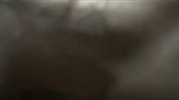 Indian couple on their honeymoon laying naked in bed enjoying passionate seductive french kissing.