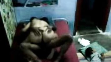 Married Telugu couple in their bedroom, hubby fixing camera to record their sex while every body in bedroom sleeping.