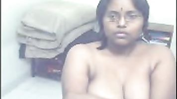 Maya aunty from Ahmedabad captured live on webcam getting naked showing her assets.